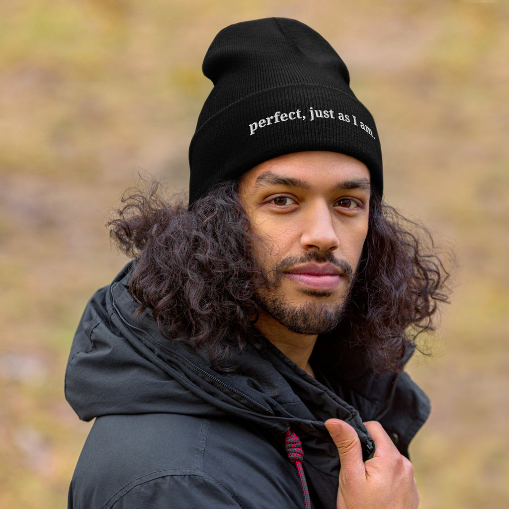 Man wearing Perfect, Just As I Am embroidered beanie from Nyxhera Creations, minimalist winter outfit