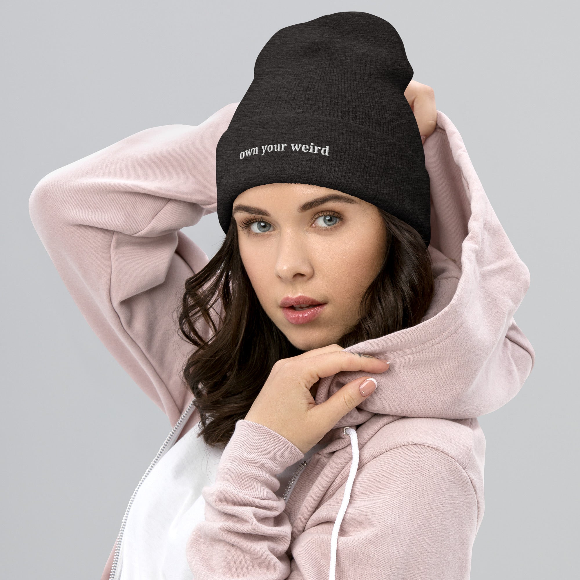 person wearing Own Your Weird embroidered beanie from Nyxhera Creations, minimalist winter look
