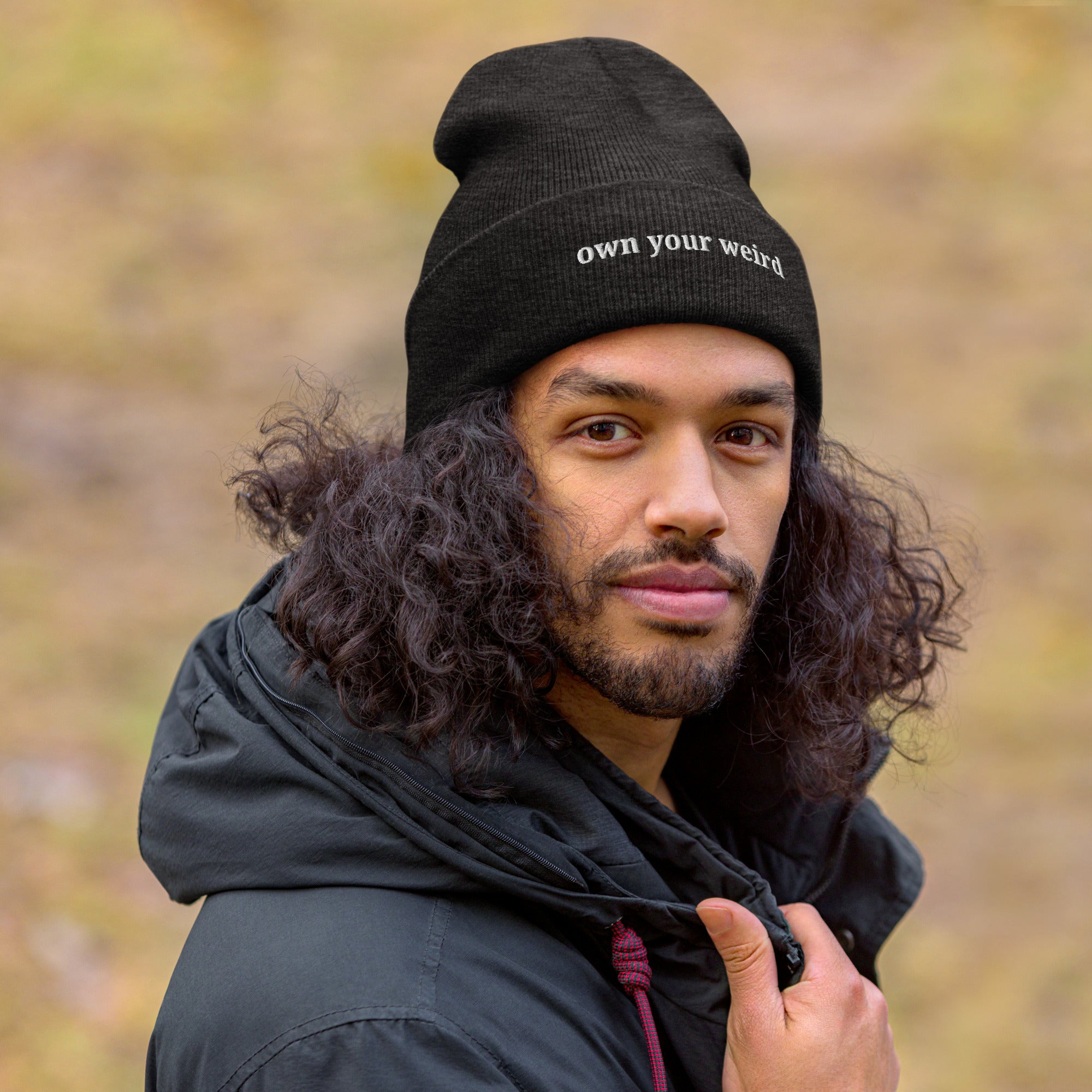 person wearing Own Your Weird embroidered dark grey beanie from Nyxhera Creations, minimalist winter look