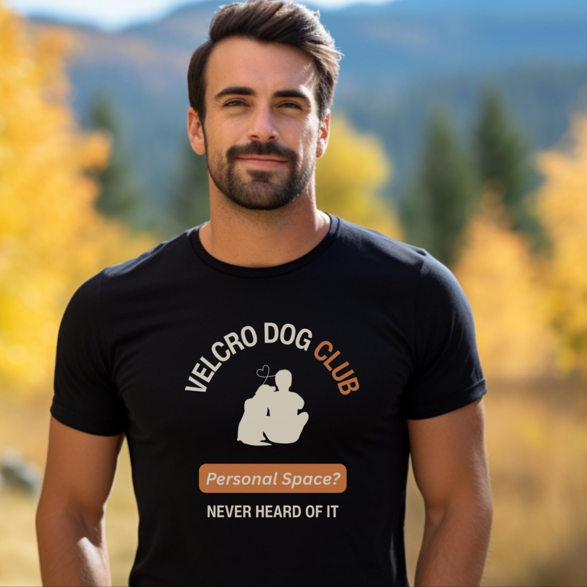 Man wearing a black t-shirt with 'Velcro Dog Club' design outdoors