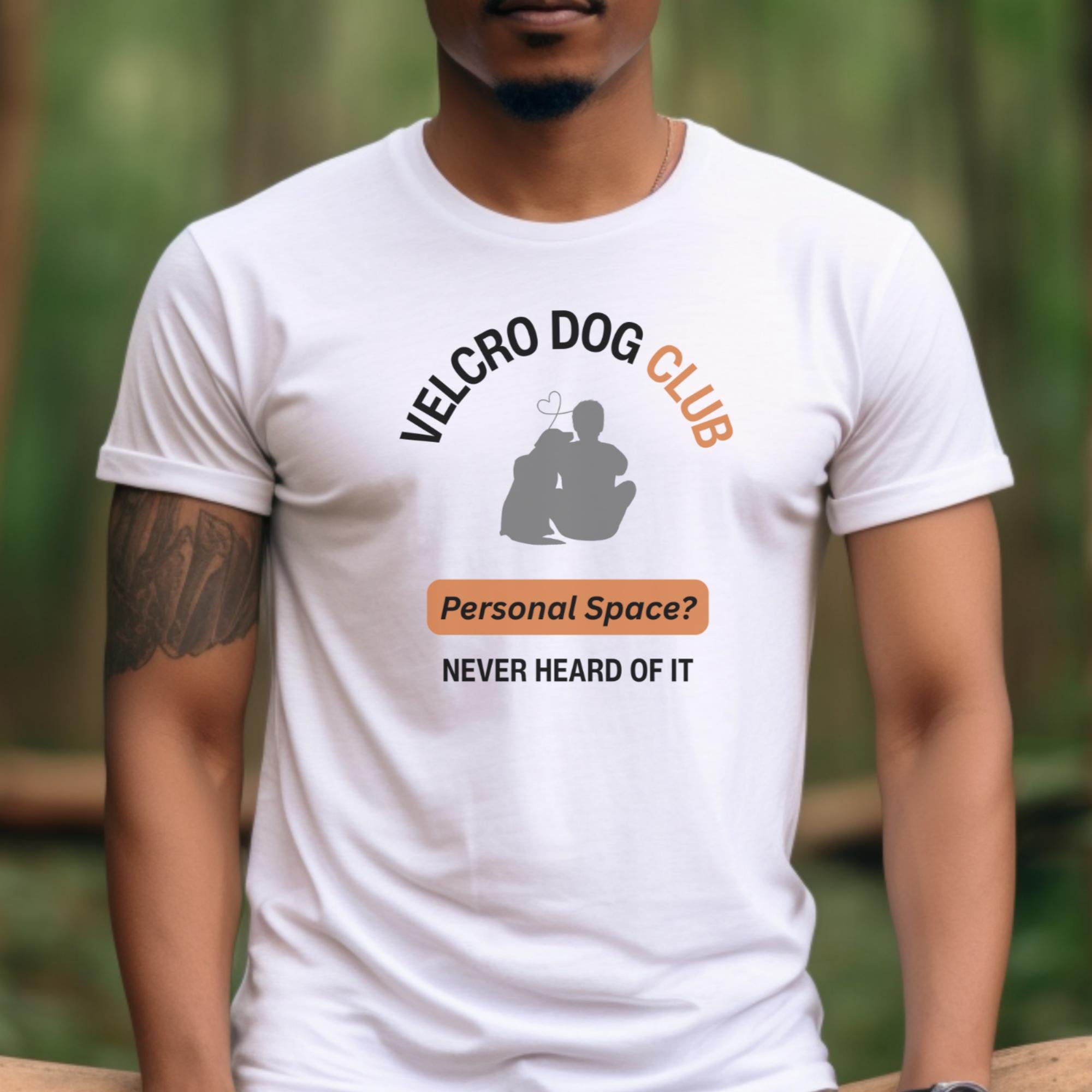 Person wearing a white t-shirt with 'Velcro Dog Club' graphic and text.