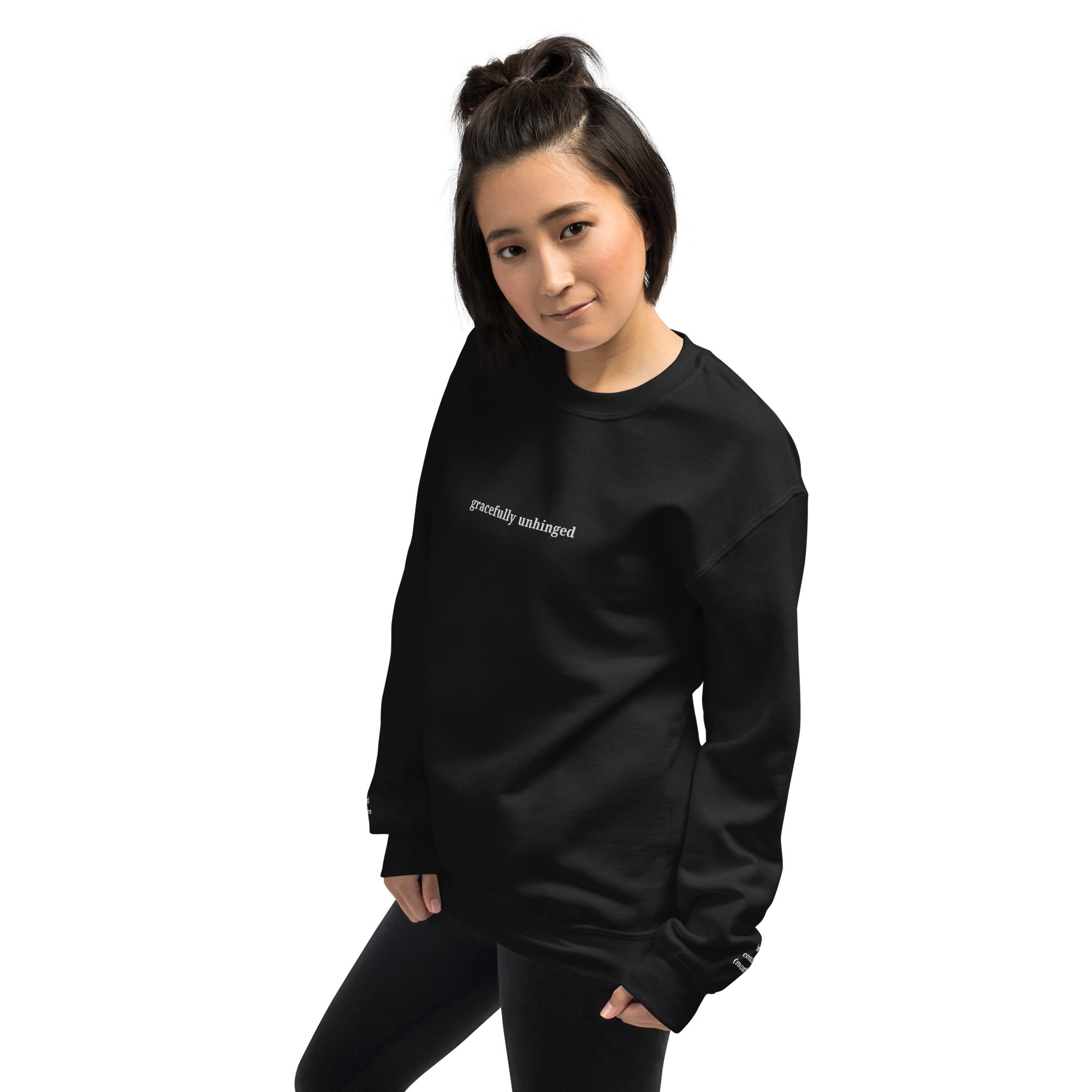 Gracefully Unhinged embroidered sweatshirt by Nyxhera Creations, black Gildan crewneck with white thread chest and cuff embroidery