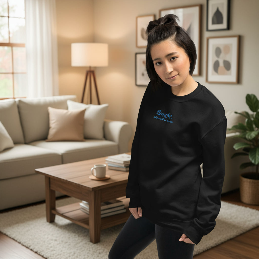 Unisex embroidered sweatshirt in black featuring quote “Breathe and It Will All Get Easier” stitched in calming blue thread.