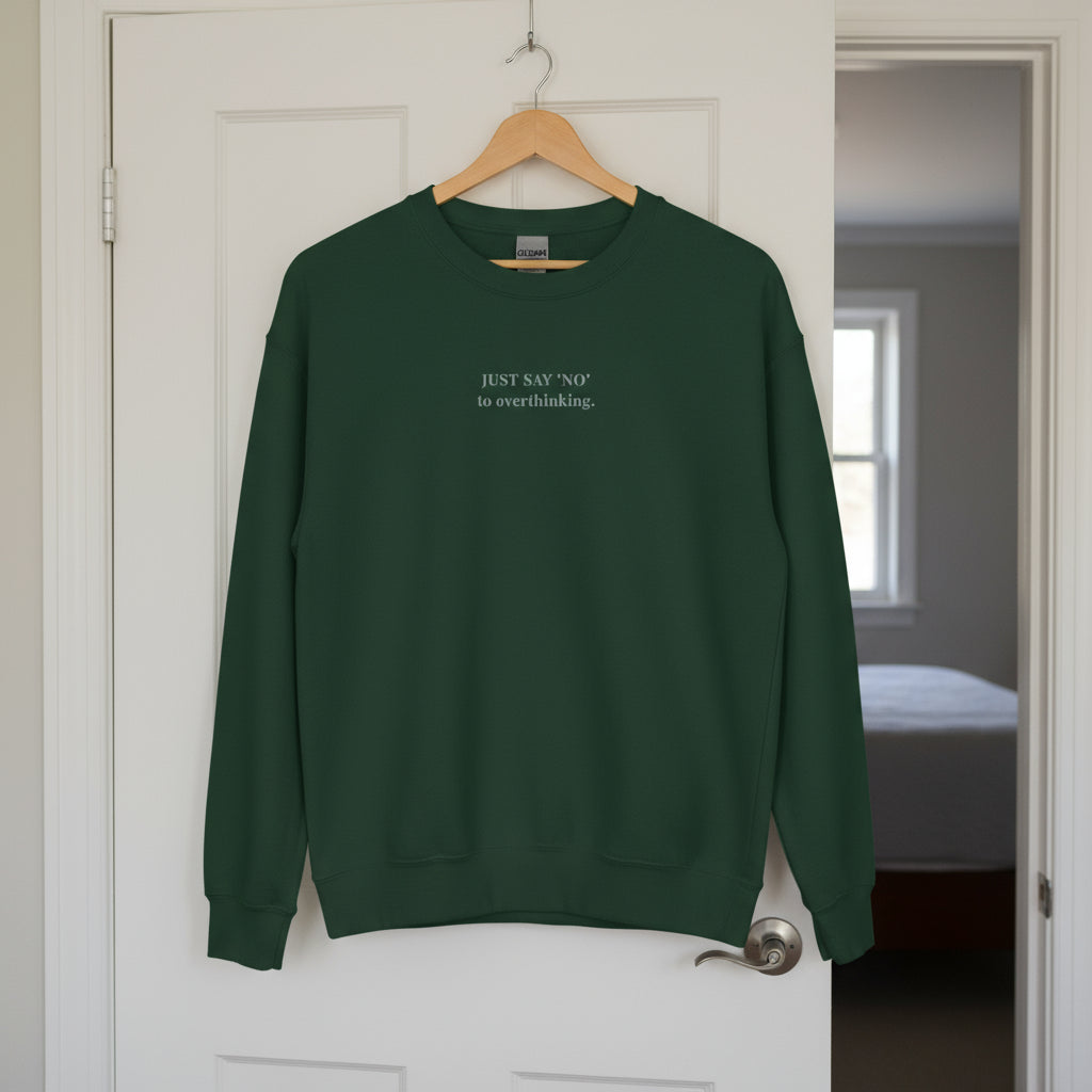 green sweatshirt with embroidered text "Just say 'no' to overthinking" in grey thread