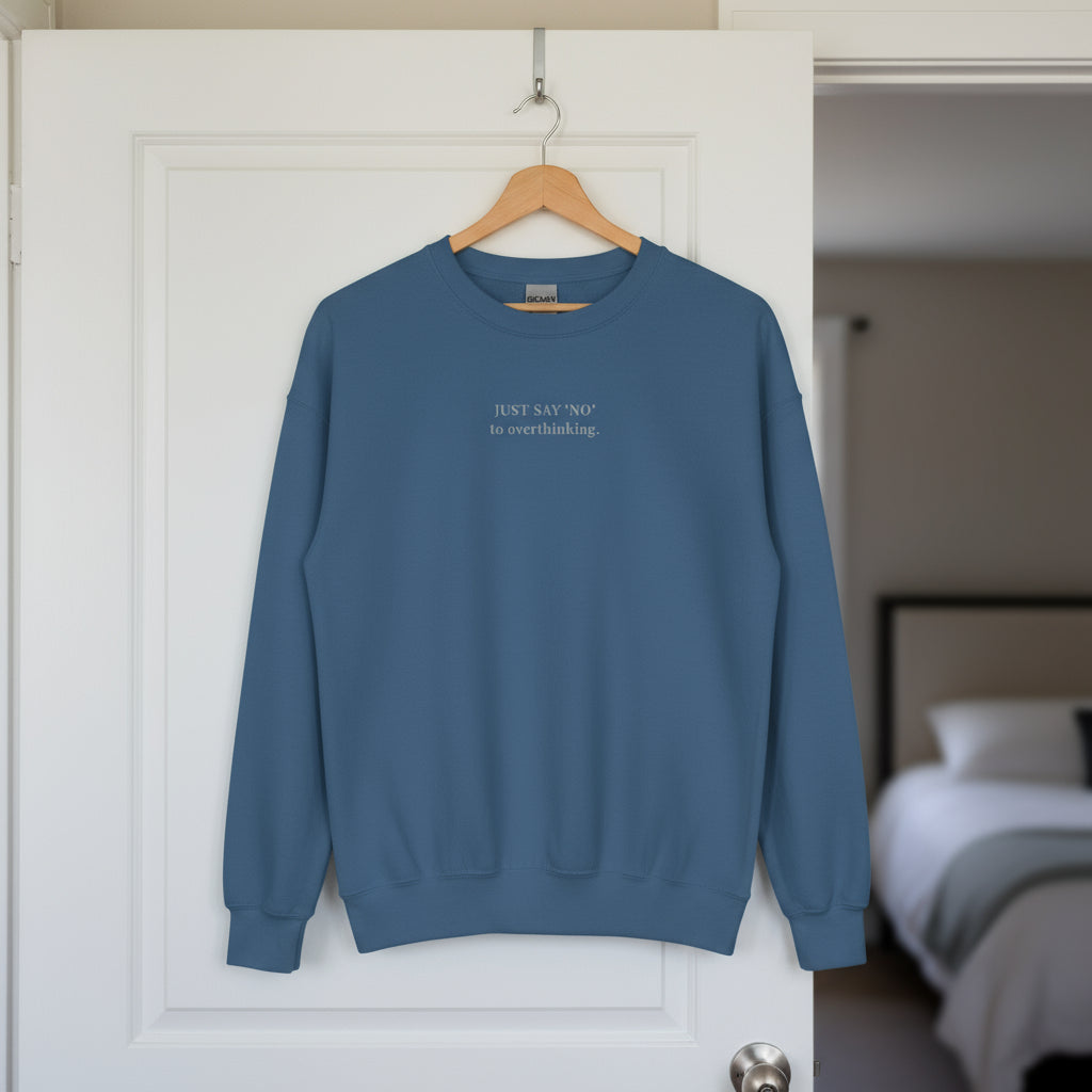 blue sweatshirt with embroidered text "Just say 'no' to overthinking" in grey thread