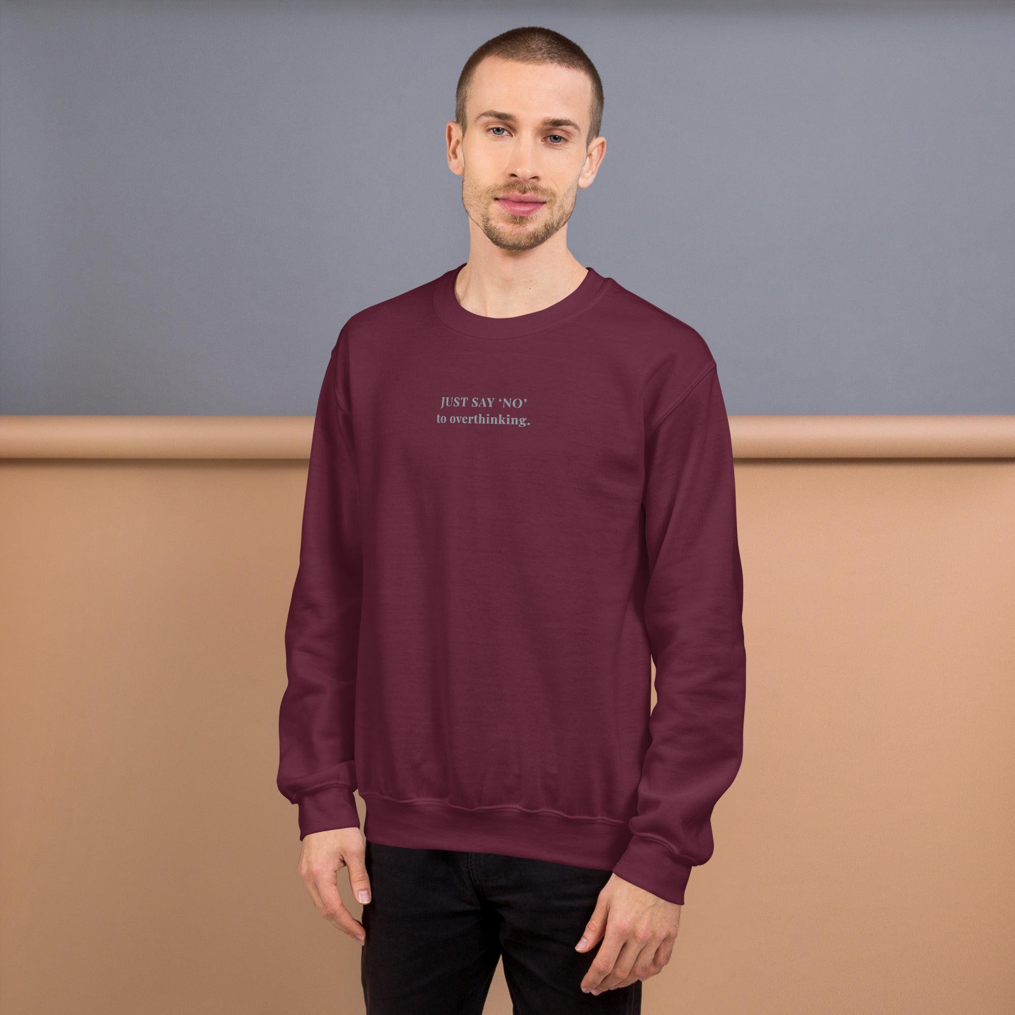 Unisex sweatshirt in maroon with embroidered text “Just Say No to Overthinking” in light grey thread.