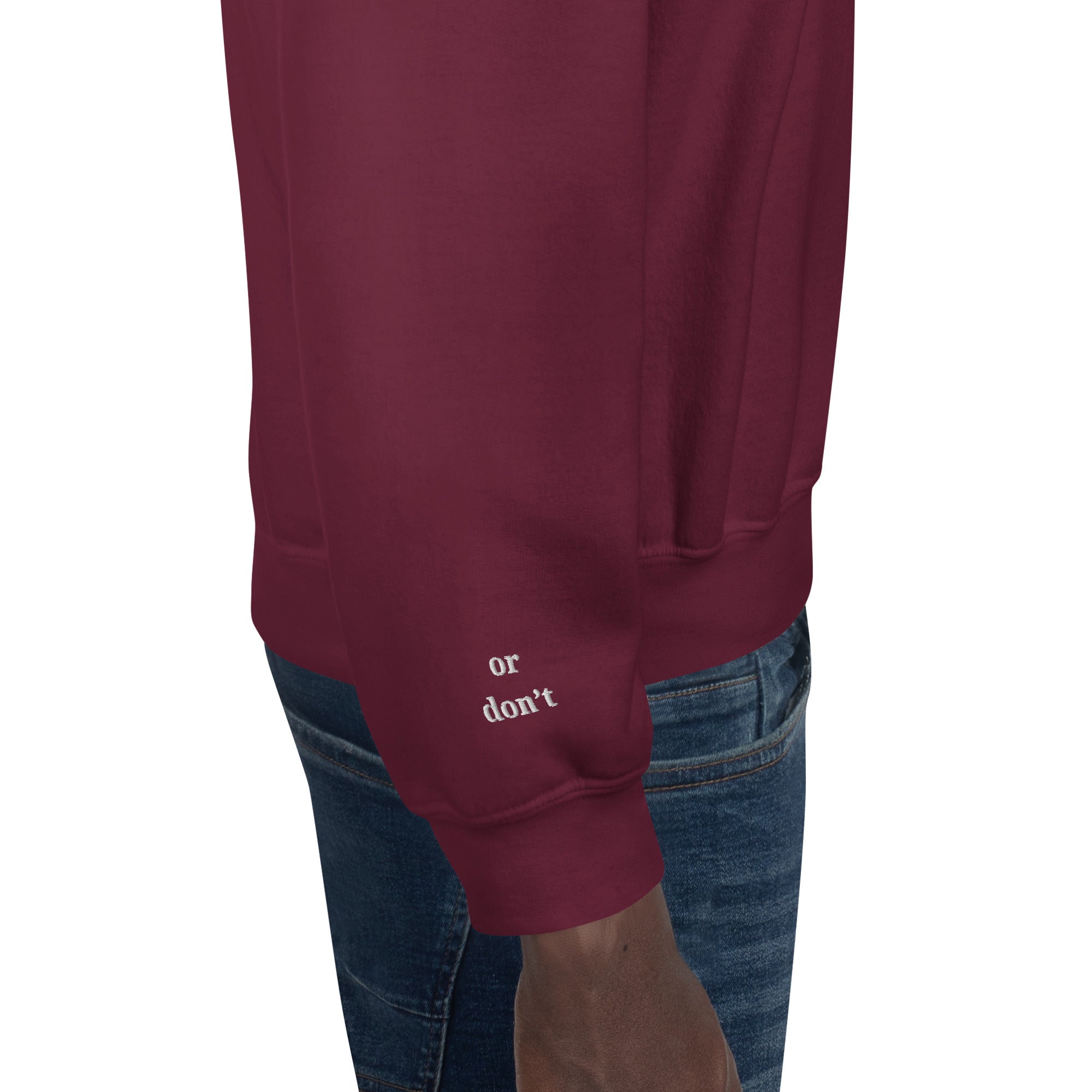 Cuff detail of embroidered text Or don’t in white thread