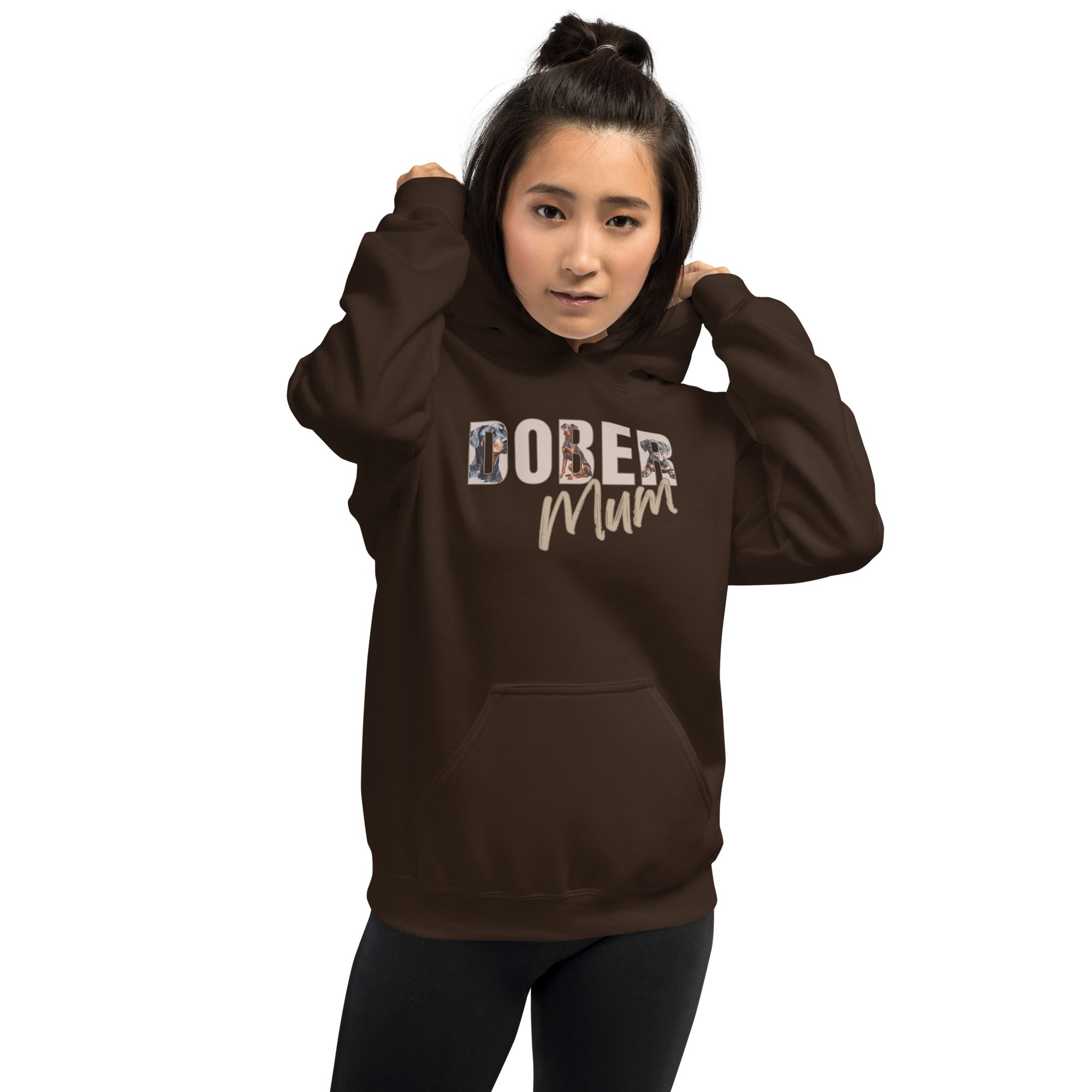 Person wearing a brown hoodie with 'DOBER MUM' text on a white background