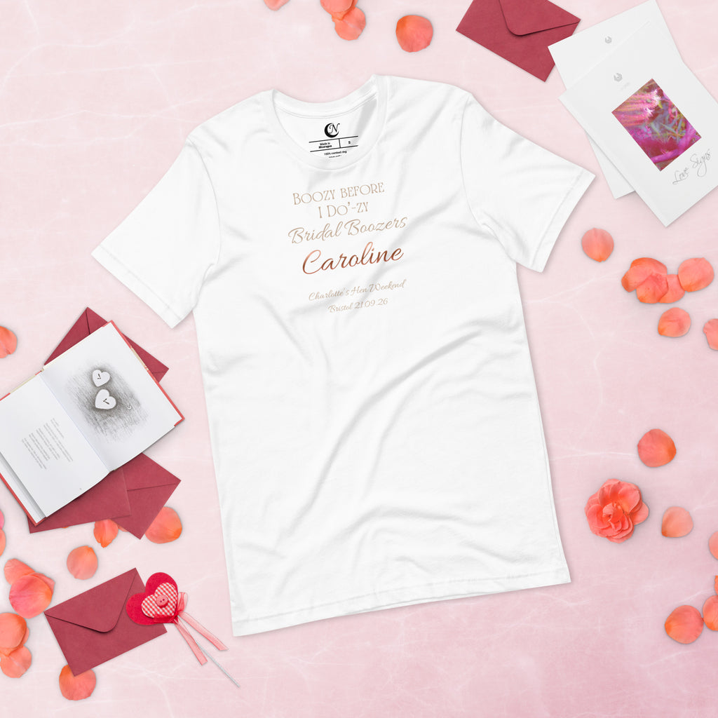 Bridal party hen t-shirt in white with metallic-effect text and personalised name replacing decorative graphics.