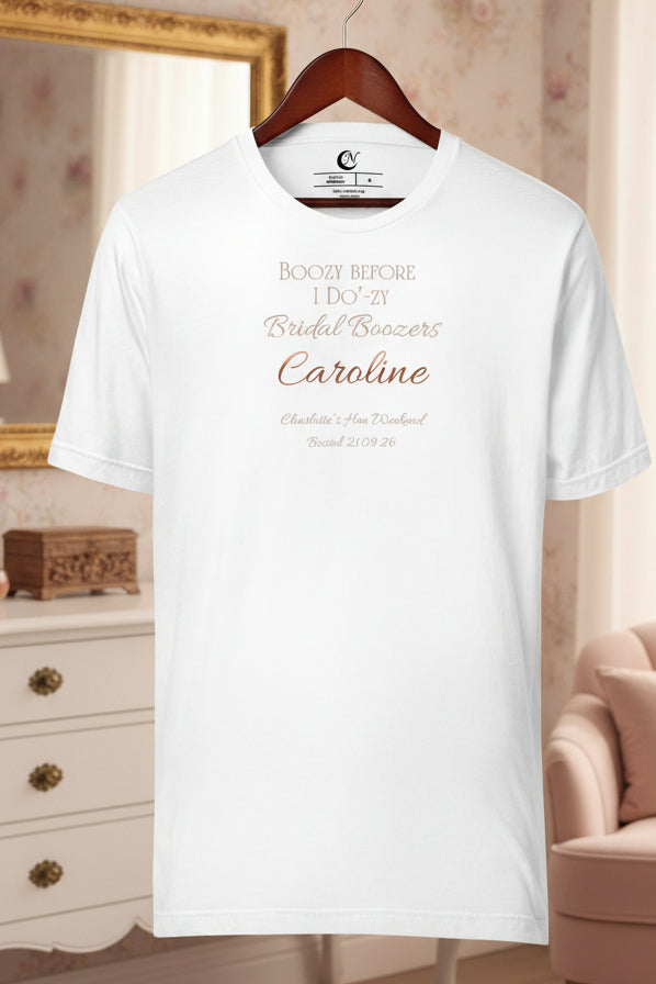 Bridal party hen t-shirt in white with metallic-effect text and personalised name replacing decorative graphics.
