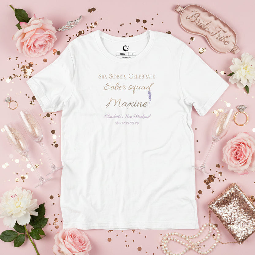 Personalised sober squad t-shirt in white featuring party member name and mauve accent text.