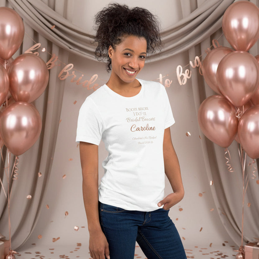 White personalised bridal party t-shirt featuring party member name and “Boozy Before I Do’zy” text, styled for a hen weekend.