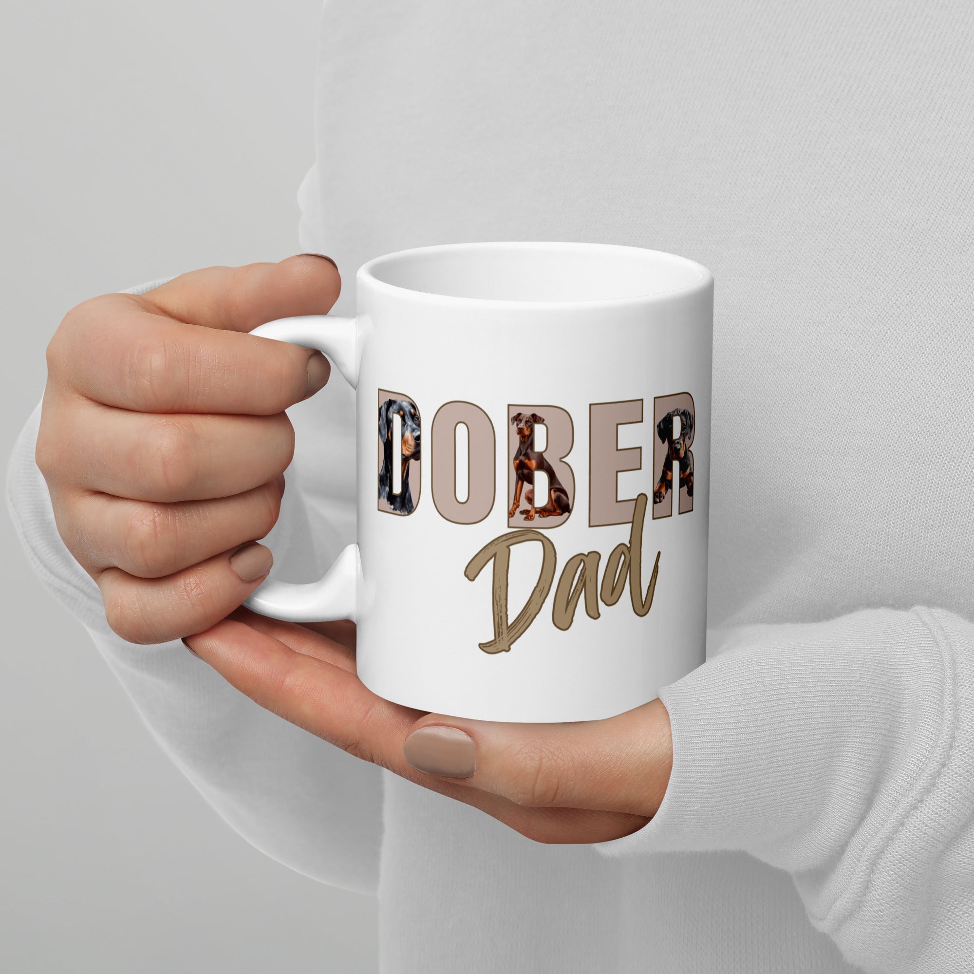 White ceramic mug with “Dober Dad” letters filled with Doberman illustrations, 11oz size