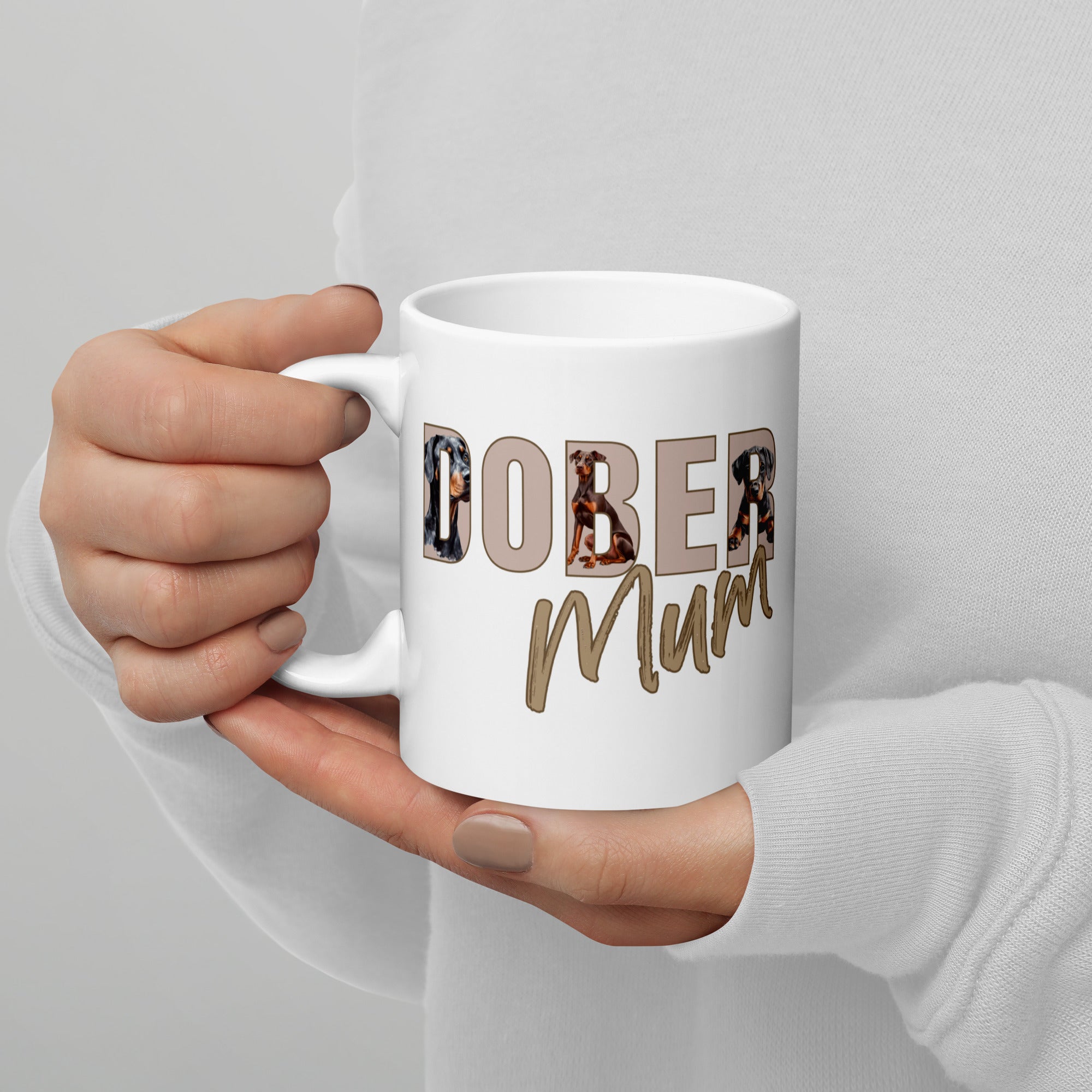White ceramic mug with “Dober Mum” letters filled with Doberman illustrations, 11oz size