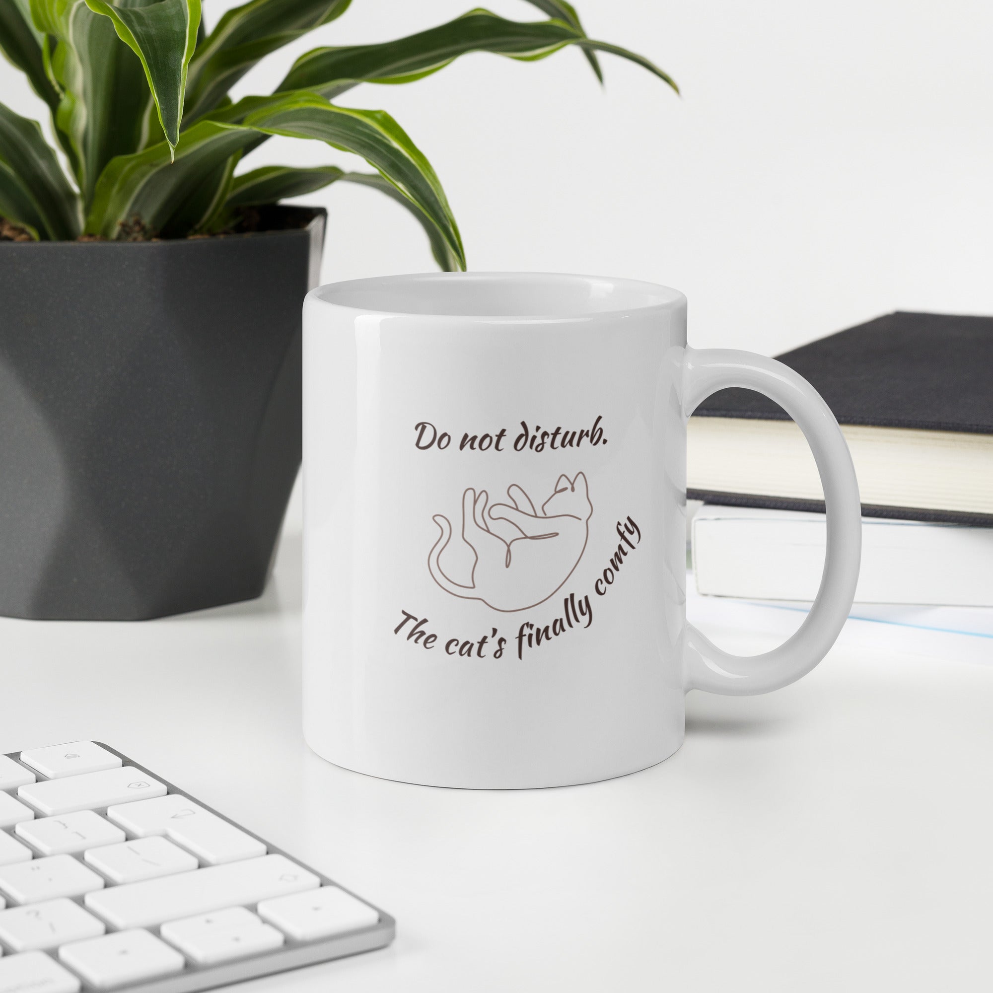 White ceramic mug with “Do Not Disturb – The Cat’s Finally Comfy” text and line-art cat, 11oz size