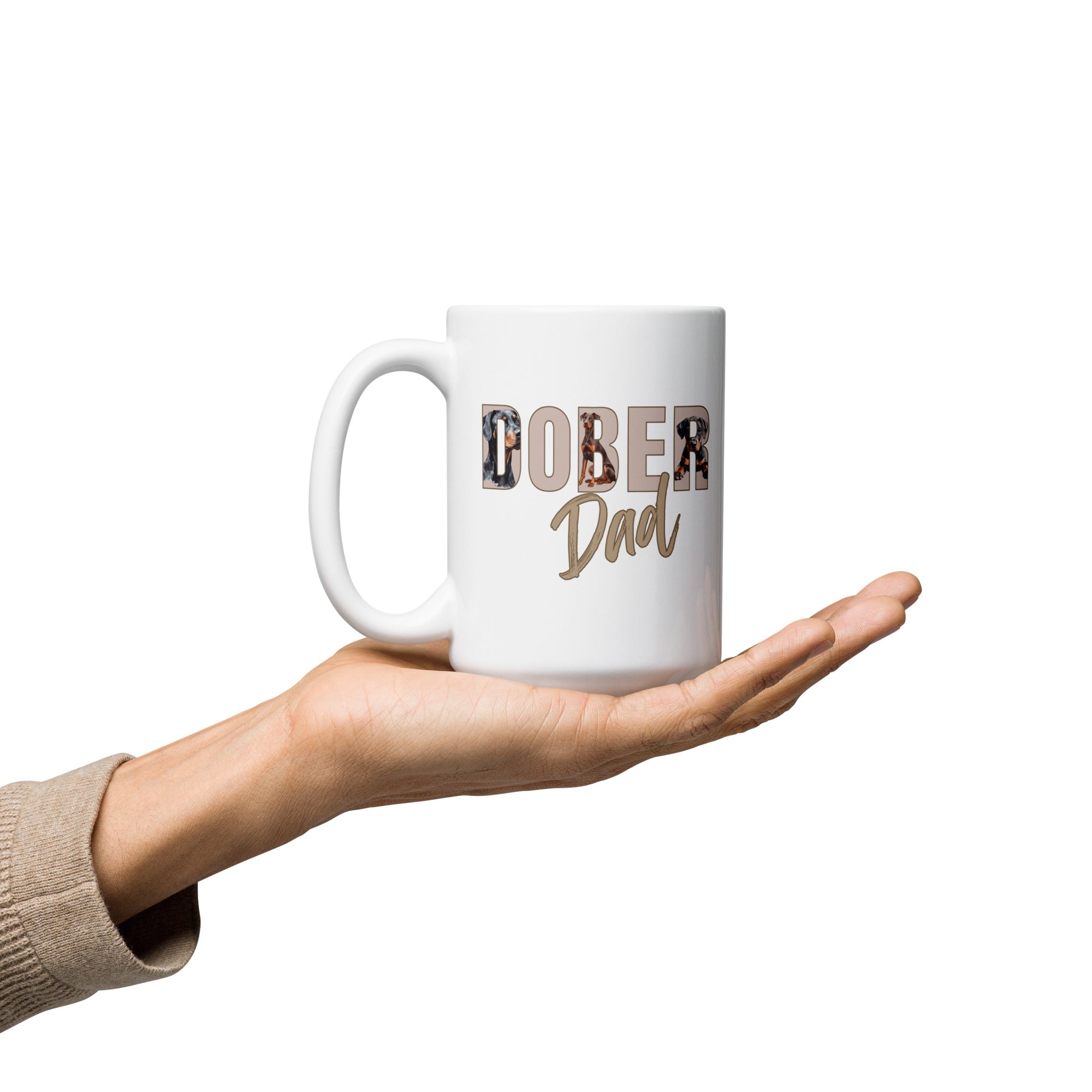White mug with 'Dober Dad' text held in a hand on a white background