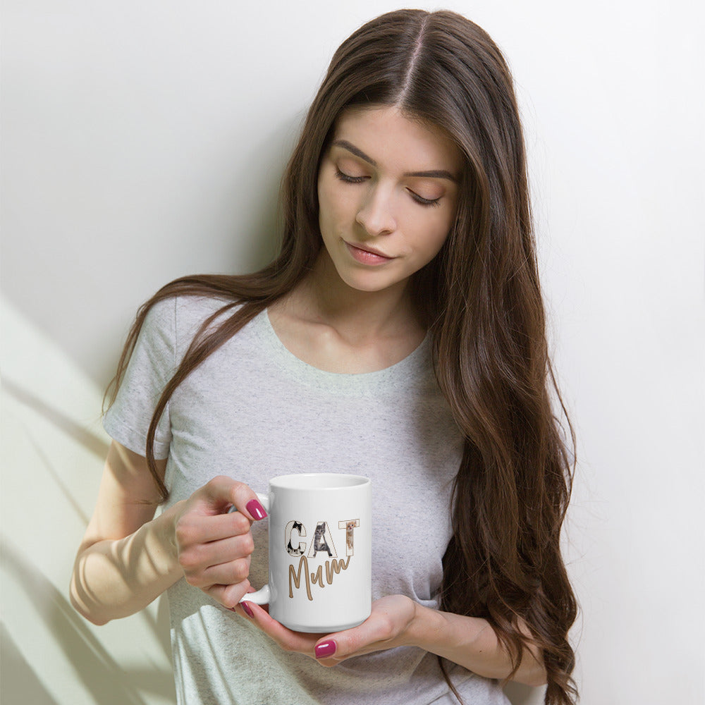 Woman holding a mug with 'Cat Mum' text against a white background