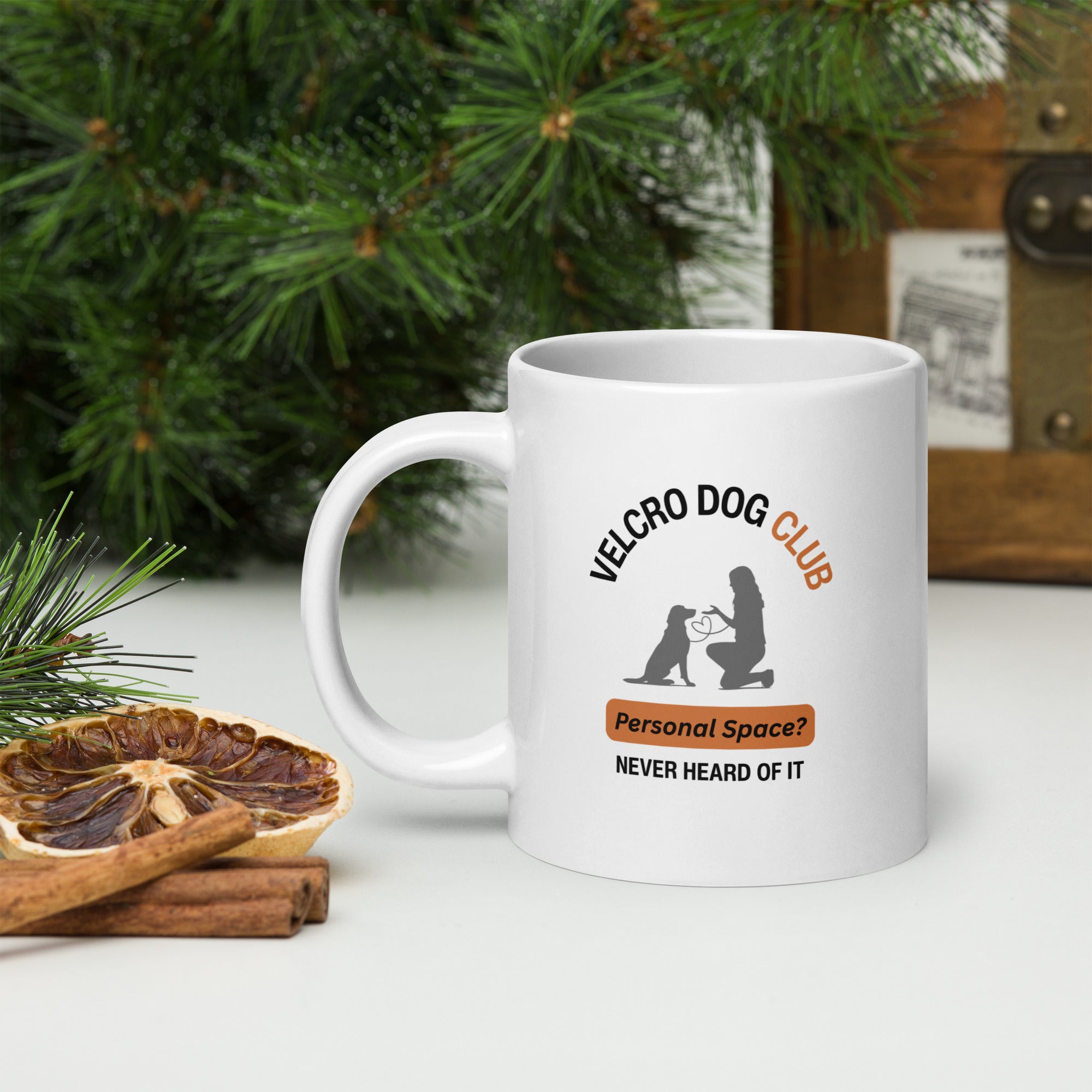 20oz White mug with Velcro Dog Club logo on a surface with decorative elements