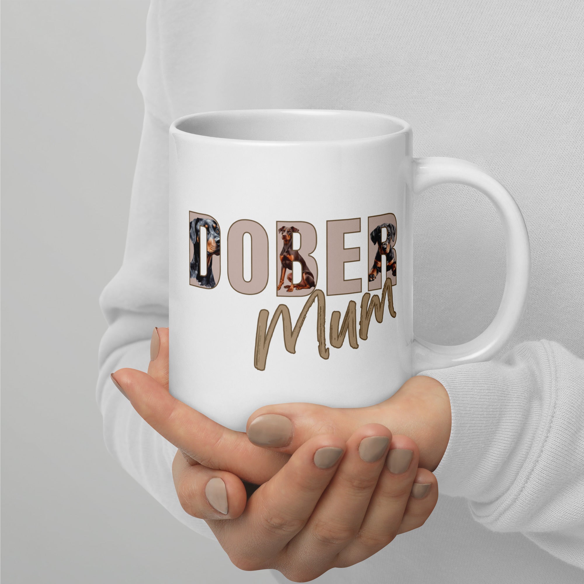 White ceramic mug with “Dober Mum” letters filled with Doberman illustrations, 20oz size