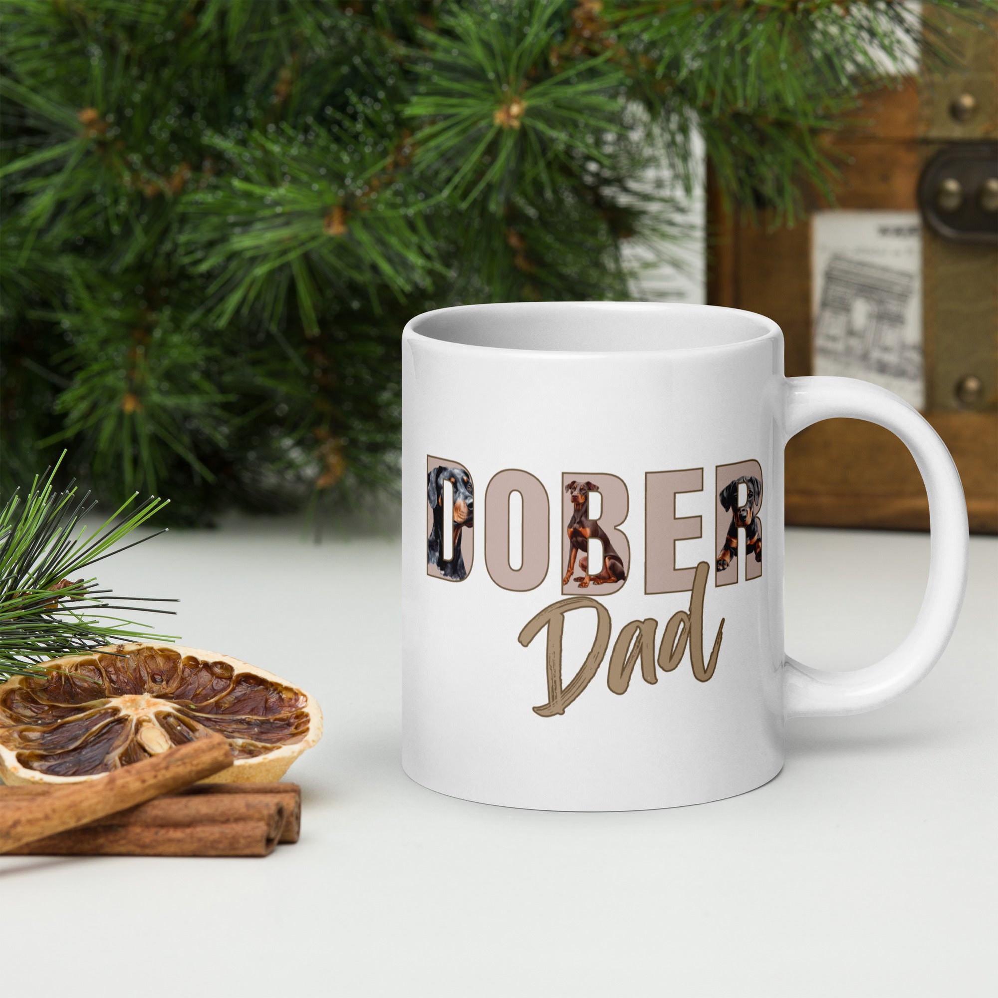 White ceramic mug with “Dober Dad” letters filled with Doberman illustrations, 20oz size